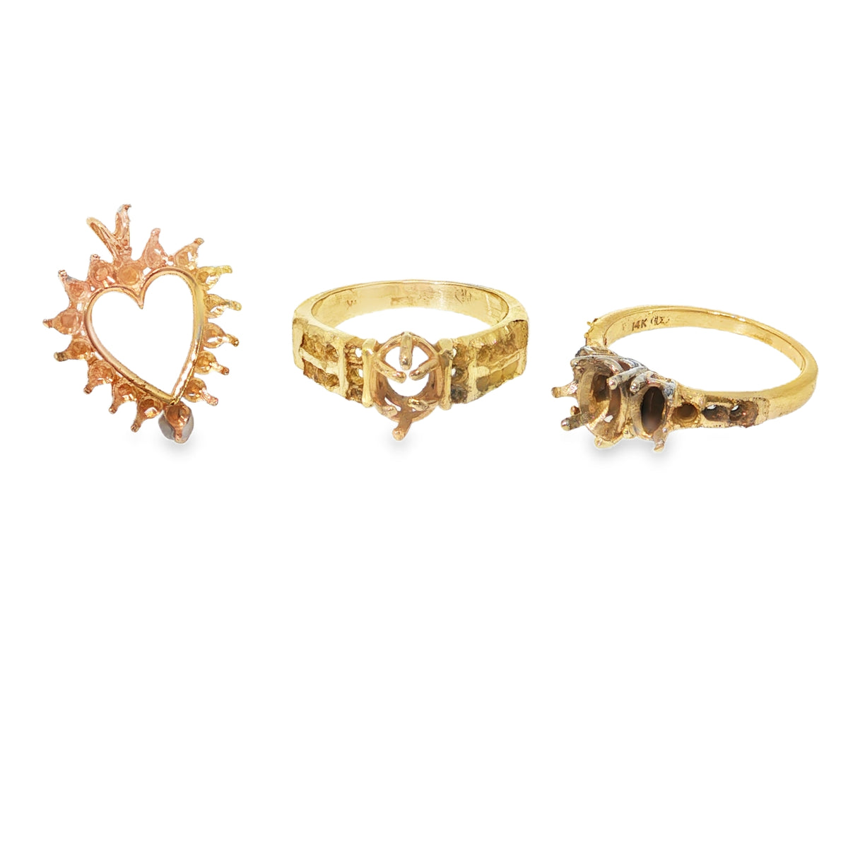 Before: a customer's heart pendant and two worn yellow gold rings with empty settings